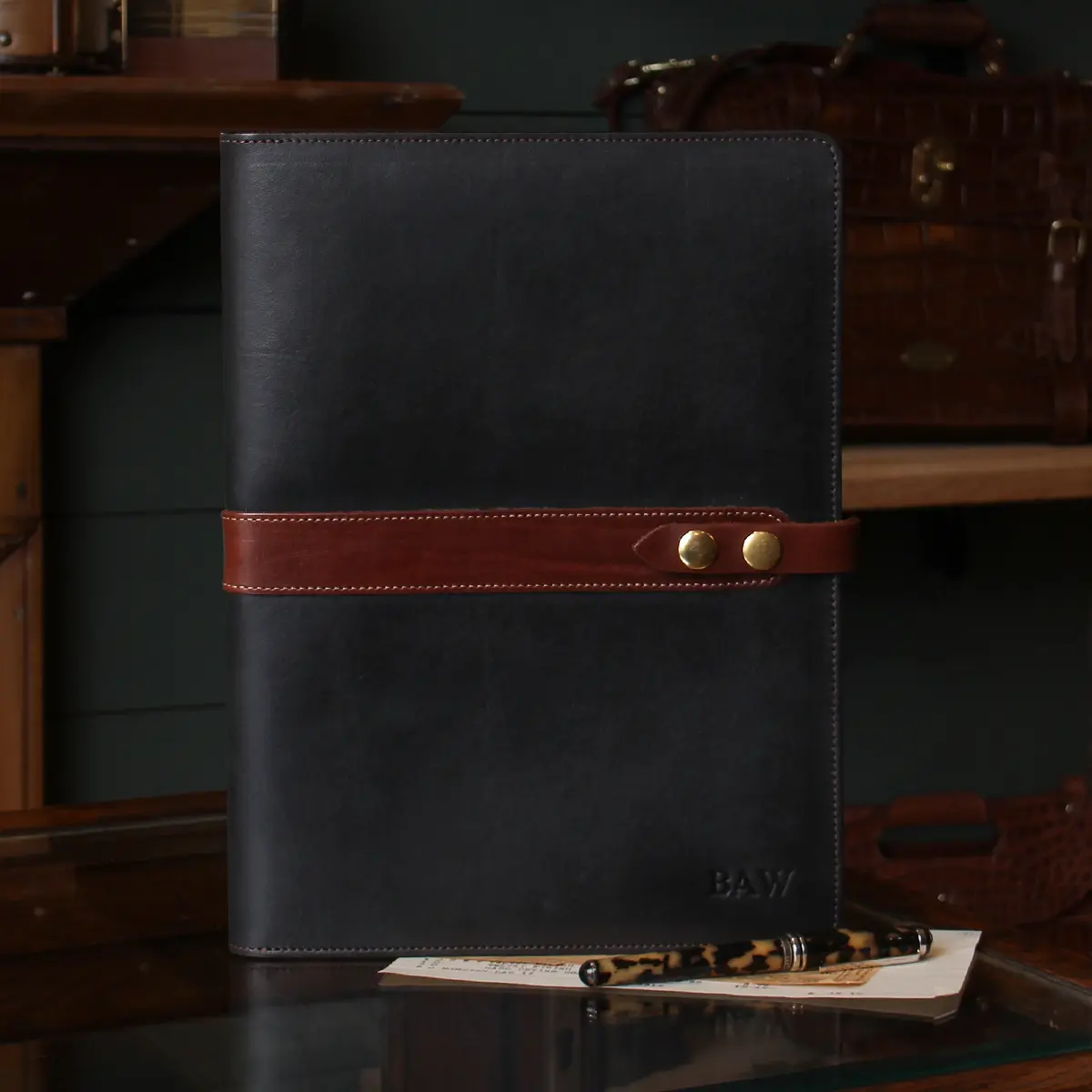 black no. 18 portfolio sitting on the retail counter