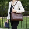 a woman wearing the wayfarer tote