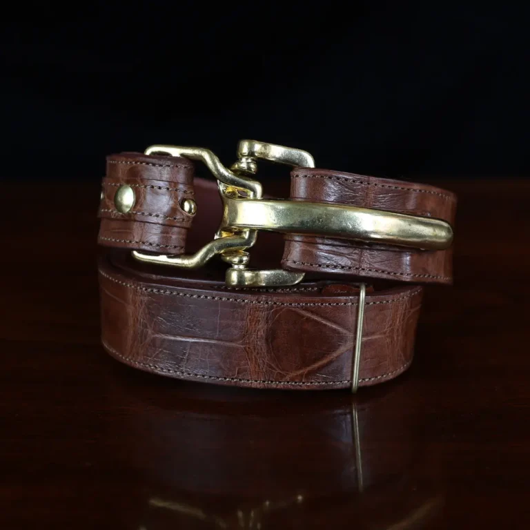 No. 5 Cinch Belt in brown American Alligator and brass buckle - ID 001 - front coiled view on black background