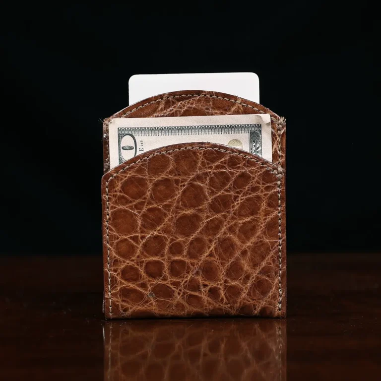 Front pocket wallet in brown American Alligator - ID 001 - front view with card on black background