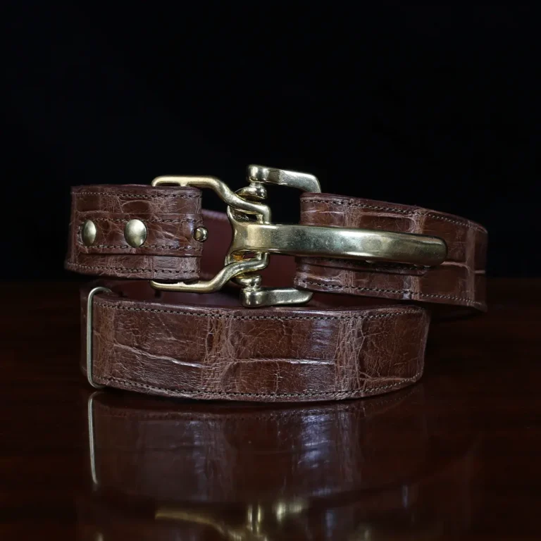 No. 5 Cinch Belt in brown American Alligator and brass buckle - ID 001 - front coiled view on black background