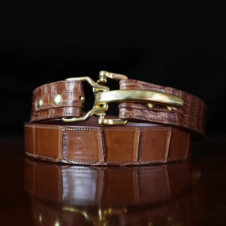 No. 5 Cinch Belt in brown American Alligator and brass buckle - ID 002 - front coiled view on black background