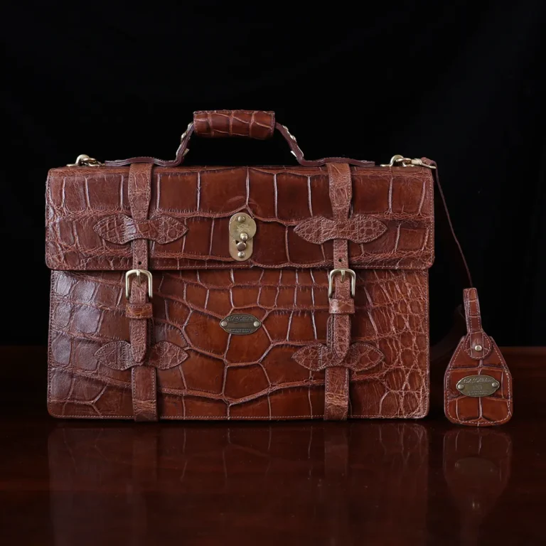 No. 1943 Navigator Briefcase in Vintage Brown American Alligator - Serial number 011 - front view with luggage tag