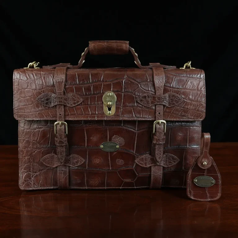 No. 1943 Navigator Briefcase in Vintage Brown American Alligator - Serial number 012 - front view with luggage tag