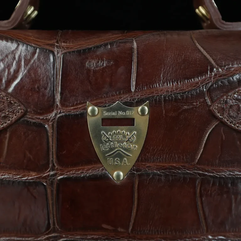 No. 1943 Navigator Briefcase in Vintage Brown American Alligator - Serial number 012 - view of pommel shield