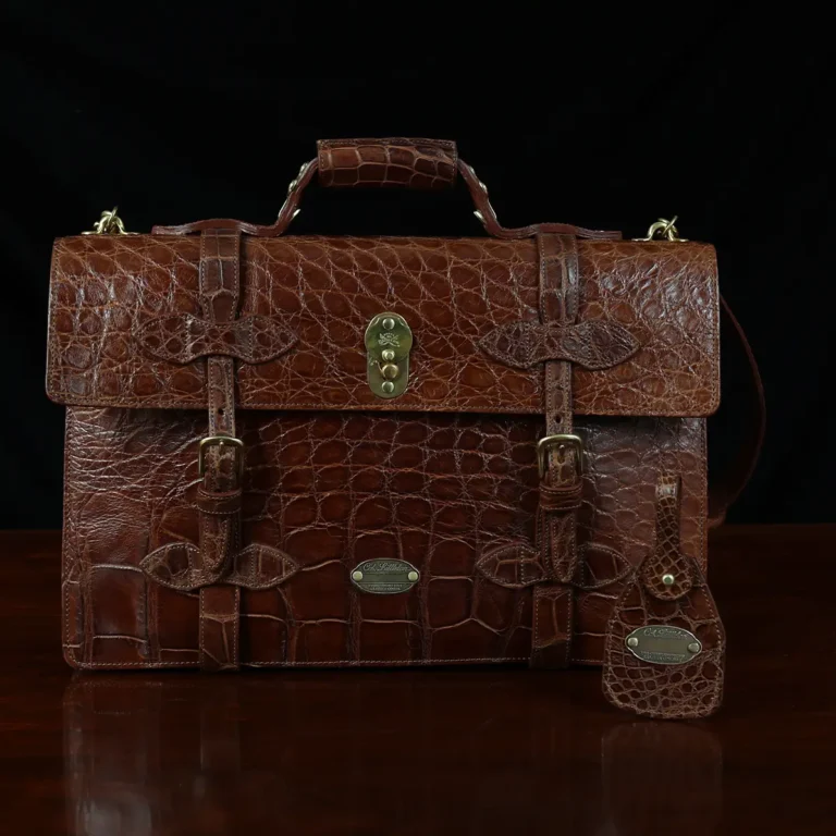 No. 1943 Navigator Briefcase in Vintage Brown American Alligator - Serial number 015 - front view with luggage tag