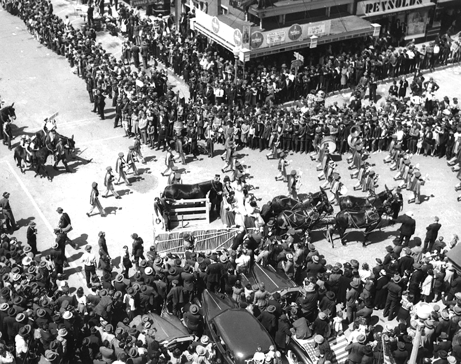 Historical black and white photo, high vantage point view of the Mule Day parade in downtown Columbia, TN