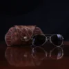 Aviator Eyecase glasses case in brown American Alligator - ID 003 - front view with glasses on a black background