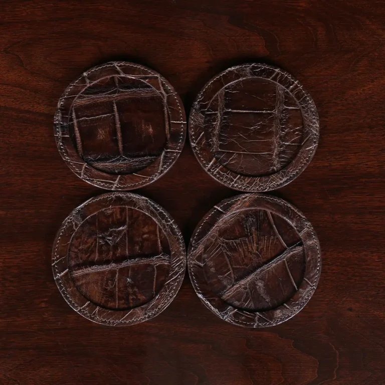 Round leather coasters in Brown American Alligator - set of 4 - ID 001 - front view of 4 coasters on a wood table