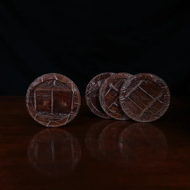 Round leather coasters in Brown American Alligator - set of 4 - ID 001 - front view of 4 coasters fanned out in a stack on black background