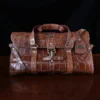 No. 1 Grip Travel Duffel Bag in Vintage Brown American Alligator - serial number 010 - Front view with luggage tag