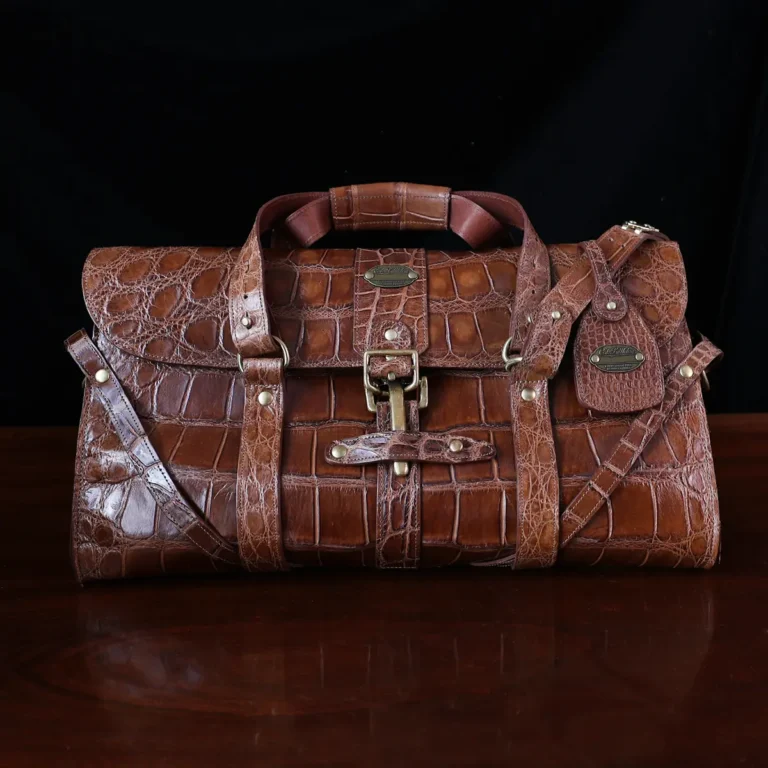 No. 1 Grip Travel Duffel Bag in Vintage Brown American Alligator - serial number 010 - Front view with luggage tag