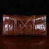 No. 1 Grip Travel Duffel Bag in Vintage Brown American Alligator - serial number 011 - bottom view with luggage tag