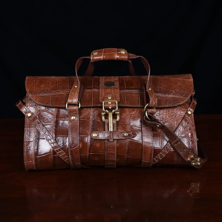 No. 1 Grip Travel Duffel Bag in Vintage Brown American Alligator - serial number 011 - Front view with luggage tag