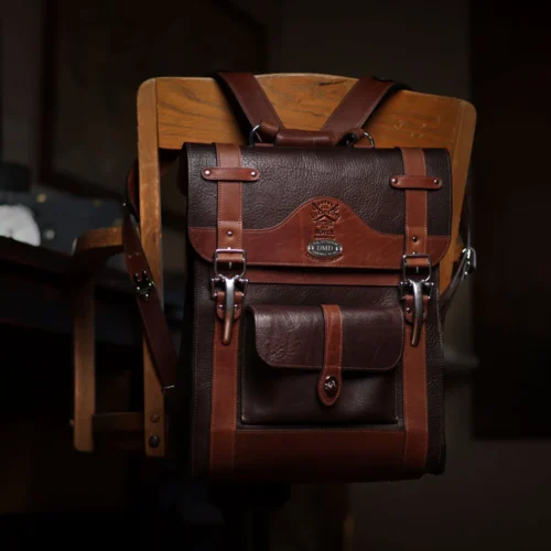 no 9 rover leather backpack in tobacco buffalo on a dark background- front view