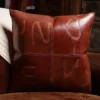 front side of a branded leather pillow