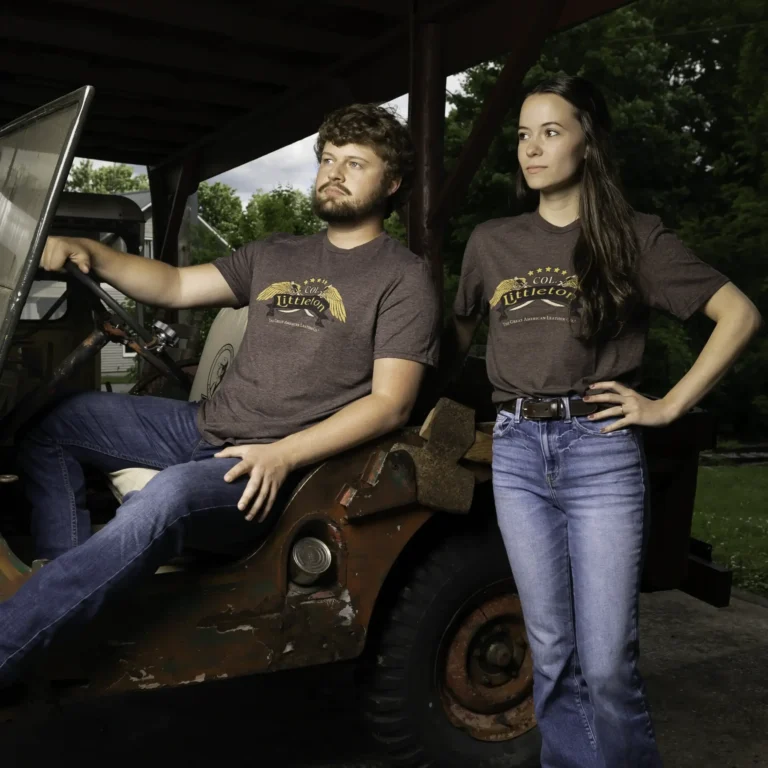 men and woman wearing the brown col. littleton shirt