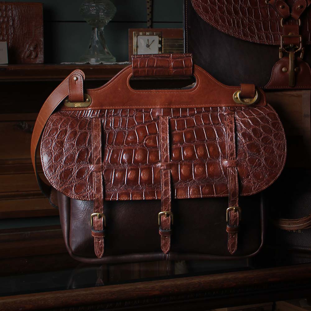 American Alligator bag sitting on a desk