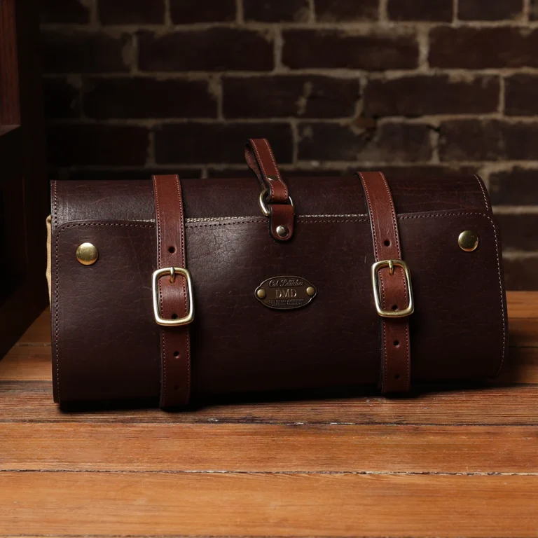 No. 2 Shave Dopp Kit in tobacco buffalo with No. 8 Khaki Cotton Canvas Lining - front view on a wooden table