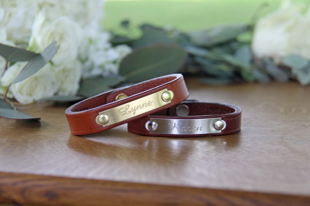 Two Camp Bracelets on wooden table