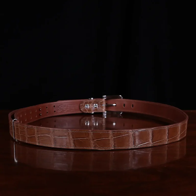 No. 4 Belt in American Alligator - X-Large - CB4XL-A-002 - back view on a wooden table with black background