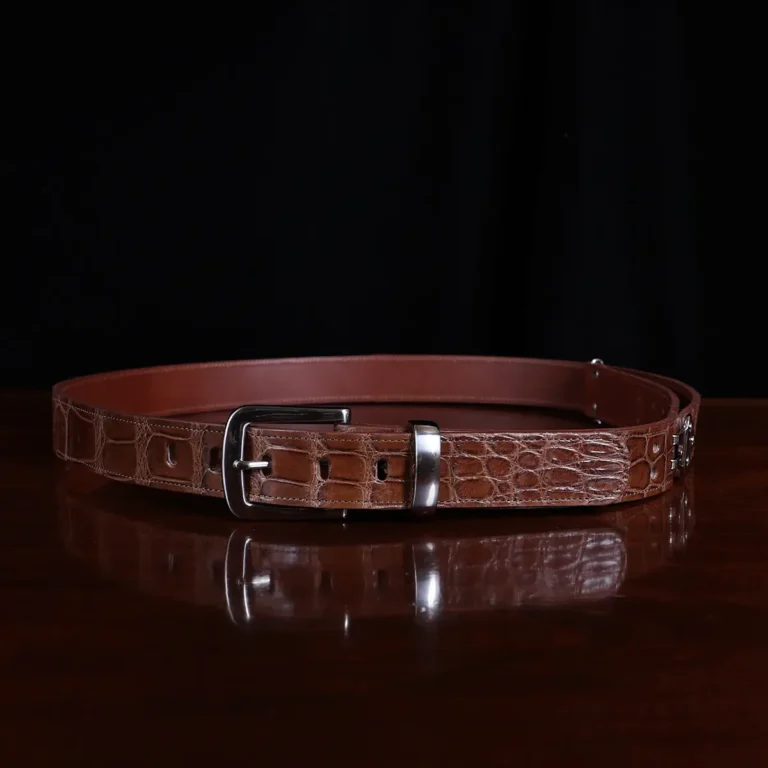 No. 4 Belt in American Alligator - X-Large - CB4XL-A-002 - coiled front view on a wooden table with black background