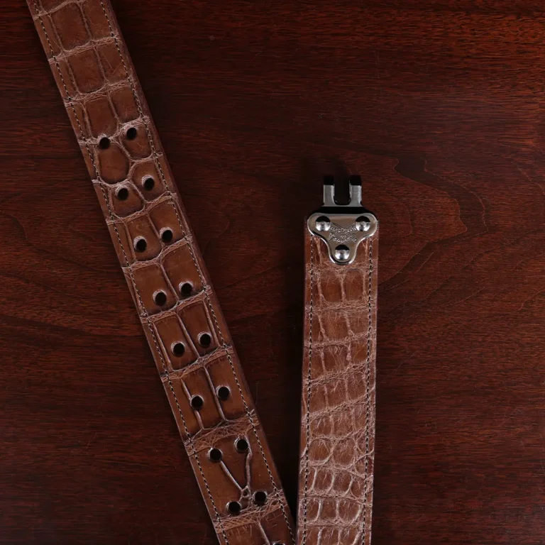 No. 4 Belt in American Alligator - X-Large - CB4XL-A-002 - clasp view on a wooden table with black background