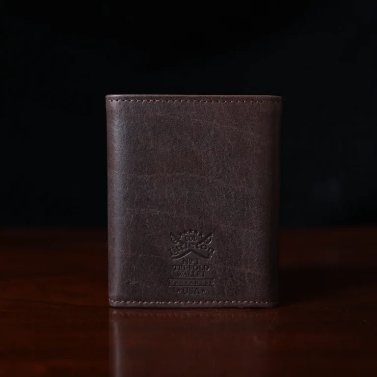 no 1 tri fold wallet in tobacco buffalo on dark background - back view