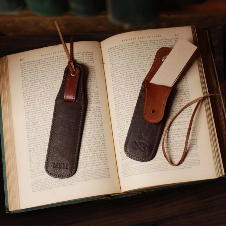 tobacco buffalo leather bookmark with secret pocket - front view on book