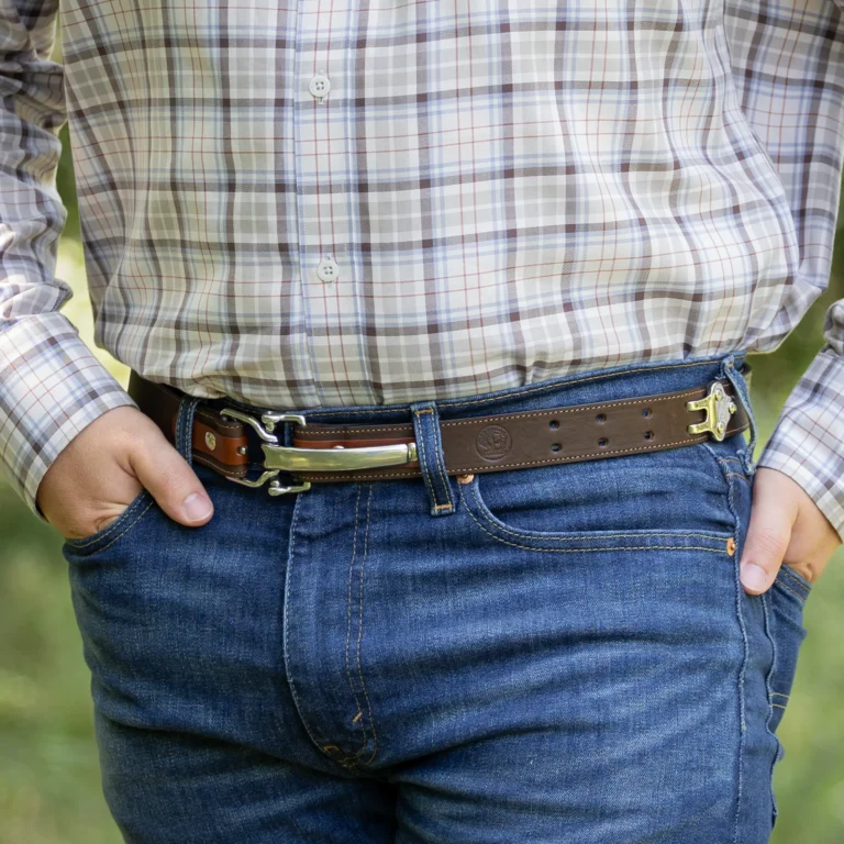 No. 5 Cinch Belt in Tobacco Buffalo Leather with Stainless accents on a man- showing the front view