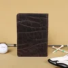 no 1 golf score card holder - back view with golf balls - golf tees - glove and golf club on light background