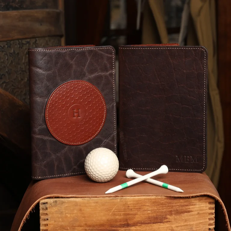 no 1 golf score card holder - front view with golf balls - golf tees - glove and golf club on light background