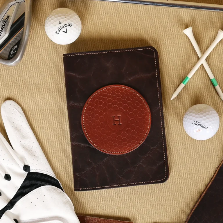 no 1 golf score card holder - front view with golf balls - golf tees - glove and golf club on light background