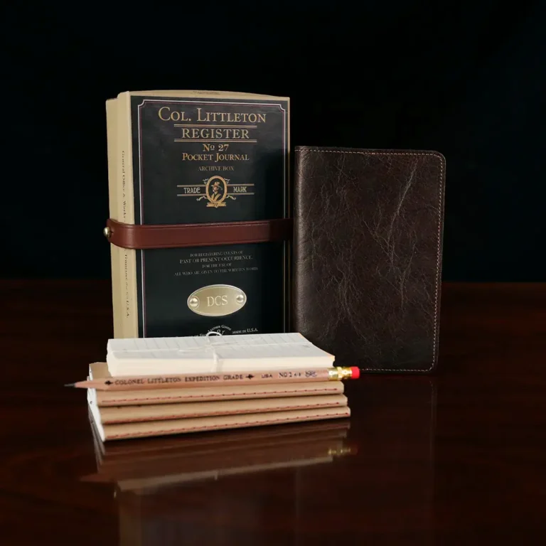 No. 27 Pocket Journal in American Buffalo - front view, shown with journal register archive box, 2 journal register notebooks, a stack of cream index notecards, and a Col. Littleton wooden No. 2 pencil