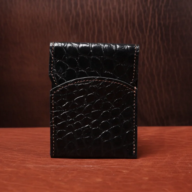 Front pocket wallet with flap in brown American Alligator - front view - 001 - on wood table with a dark background