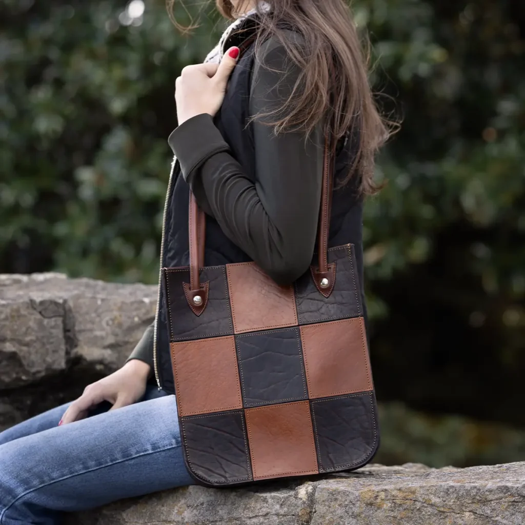 girl with the full grain leather tote with american steerhide and american buffalo with a pocket and handles