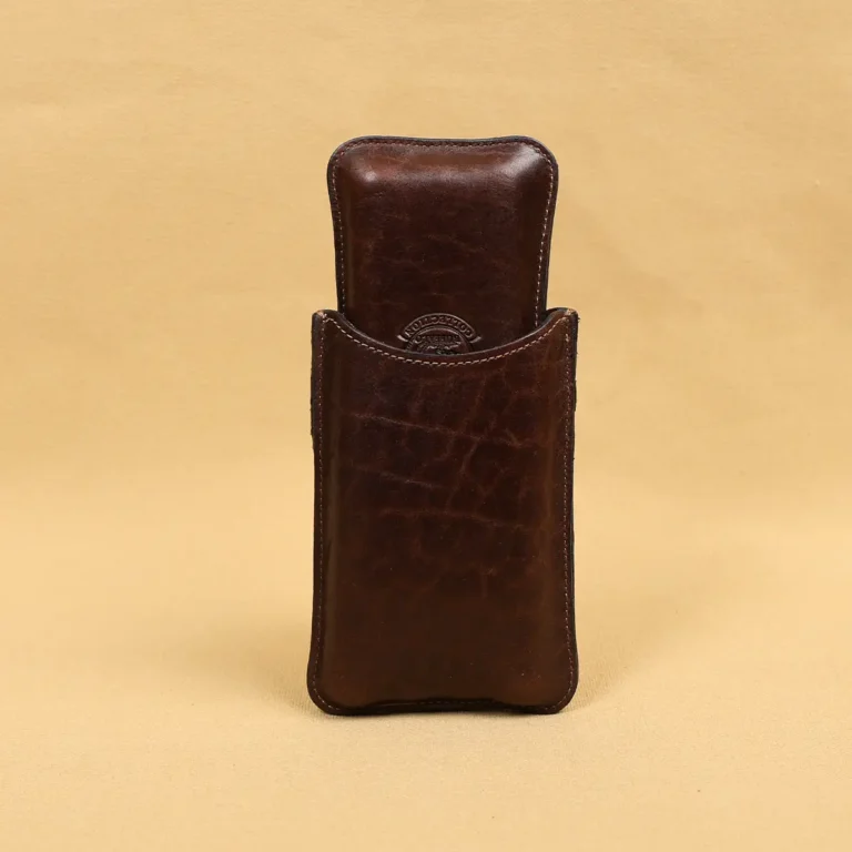 The back side of a leather cigar case in American Buffalo and American Alligator trim with brass hardware.